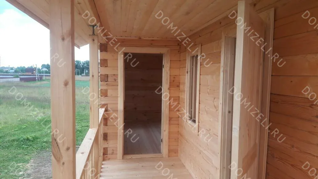 Дом из бруса 8×9 с двумя балконами